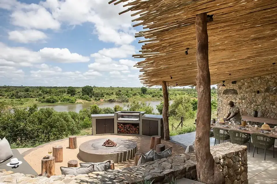 Outdoor seating area with scenic river view.